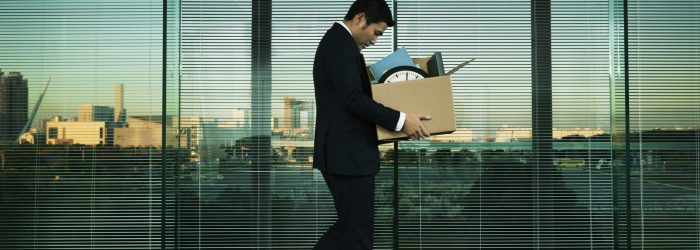 Subject: A Japanese business office worker leaving his job with all his belonging in a layoff and economic recession.